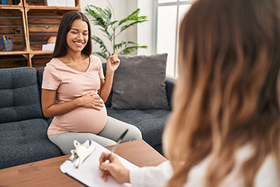 pregnant woman getting adoption counseling